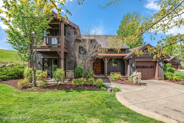 17036 S Citrine Dr, Coeur Dalene, ID 83814 - view of front of property with concrete driveway, a garage, a front lawn, a balcony, and stone siding