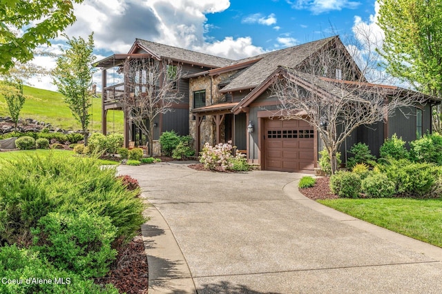 17036 S Citrine Dr, Coeur Dalene, ID 83814 - view of front of home with driveway, an attached garage, and a balcony