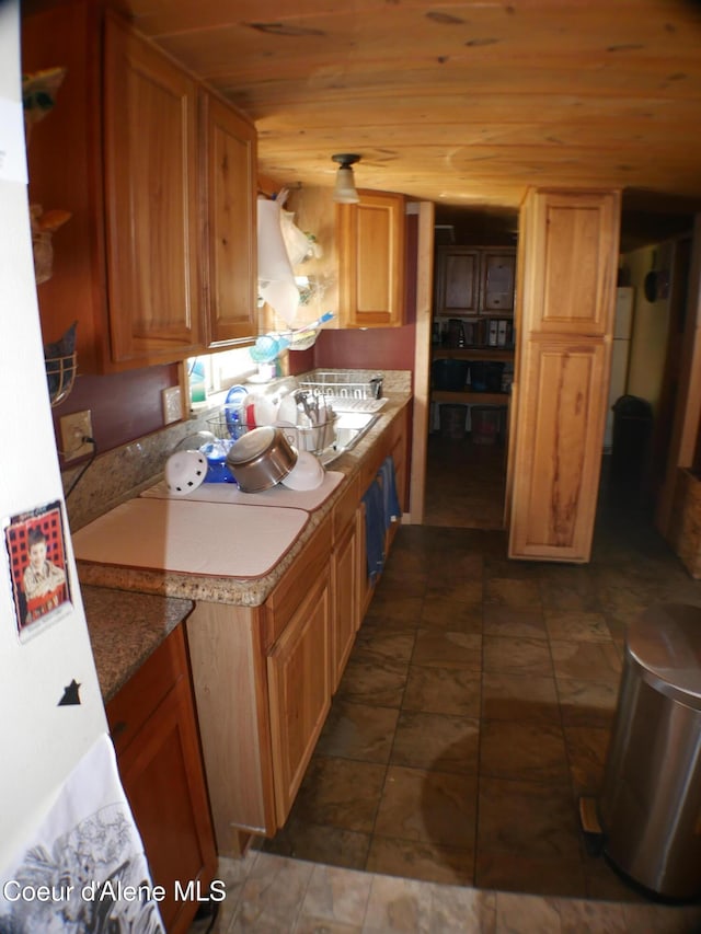 2820 Little Carpenter Creek Rd, Fernwood, ID 83830 - kitchen with wooden ceiling and brown cabinetry