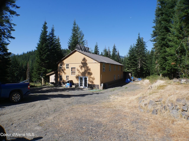 2820 Little Carpenter Creek Rd, Fernwood, ID 83830 - view of home's exterior featuring a wooded view and french doors