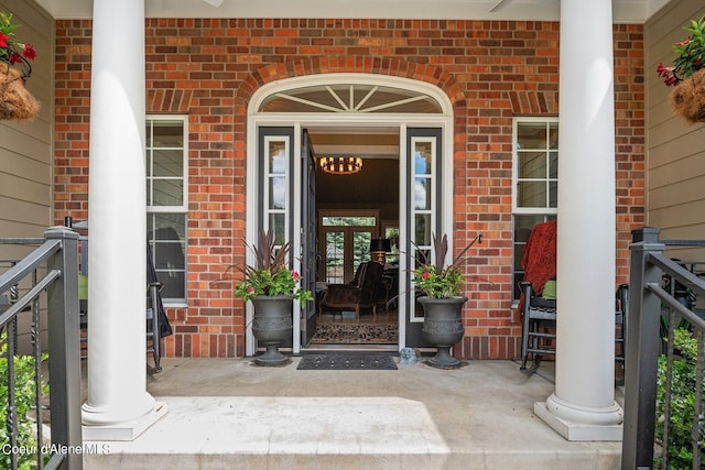 view of exterior entry featuring a porch