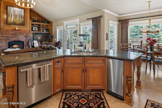 kitchen with an inviting chandelier, stainless steel dishwasher, decorative light fixtures, and dark stone countertops