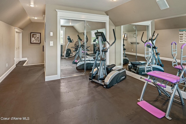 gym featuring vaulted ceiling