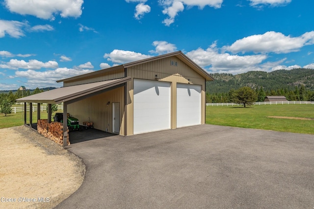 garage with a lawn