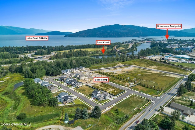 aerial view featuring a water and mountain view