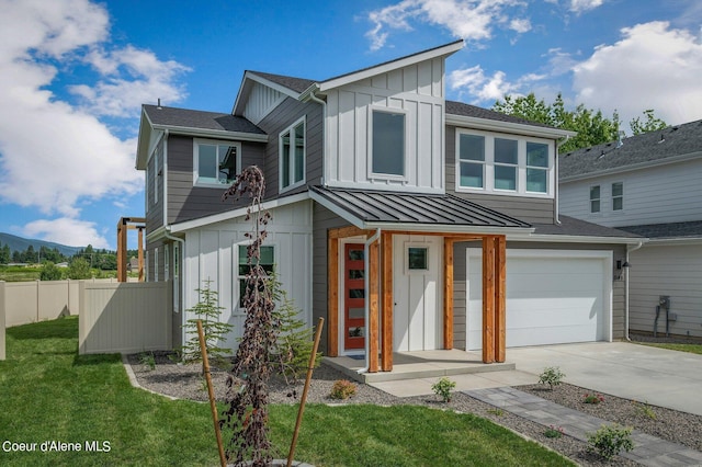 view of front of house with a garage and a front lawn