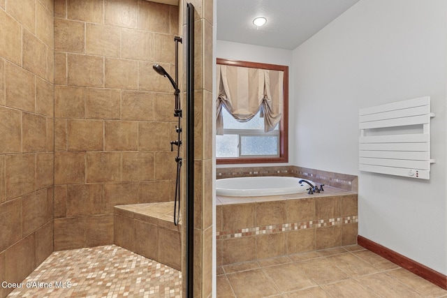 bathroom with shower with separate bathtub and tile patterned floors