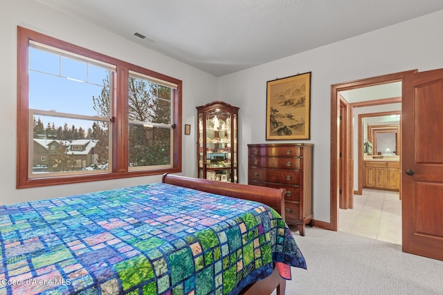 bedroom with light colored carpet