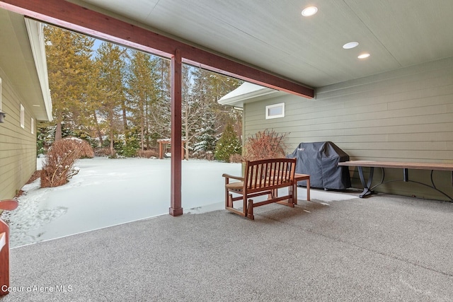 sunroom / solarium featuring beam ceiling