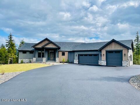 craftsman house with a garage