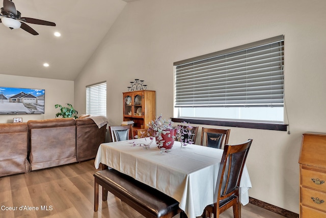 dining area with ceiling fan, high vaulted ceiling, recessed lighting, wood finished floors, and baseboards