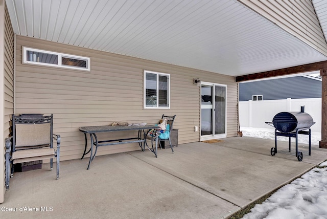 view of patio / terrace with area for grilling and fence