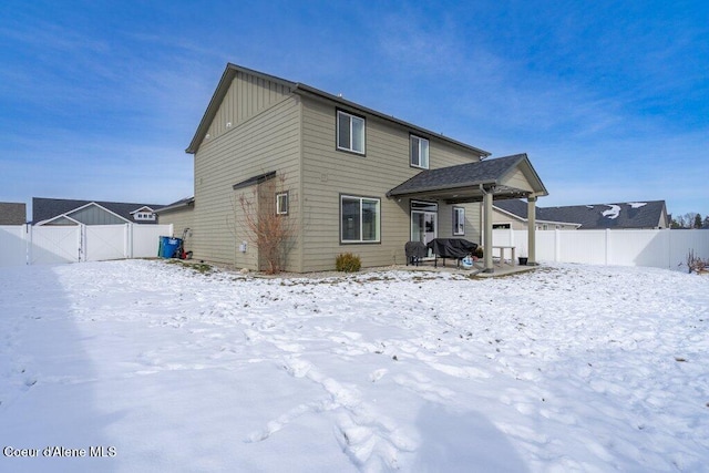 view of snow covered house