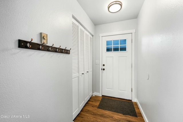 doorway to outside featuring dark hardwood / wood-style flooring