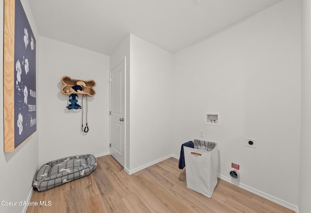 1497 N Luna St, Post Falls, ID 83854 - clothes washing area featuring hookup for a washing machine, electric dryer hookup, and light hardwood / wood-style flooring