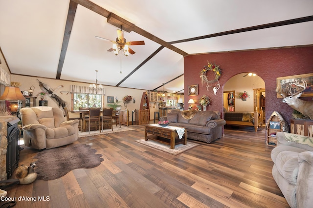 living room featuring ceiling fan with notable chandelier, lofted ceiling, and hardwood / wood-style floors