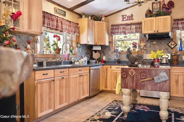 kitchen with dishwasher, lofted ceiling, and light brown cabinetry