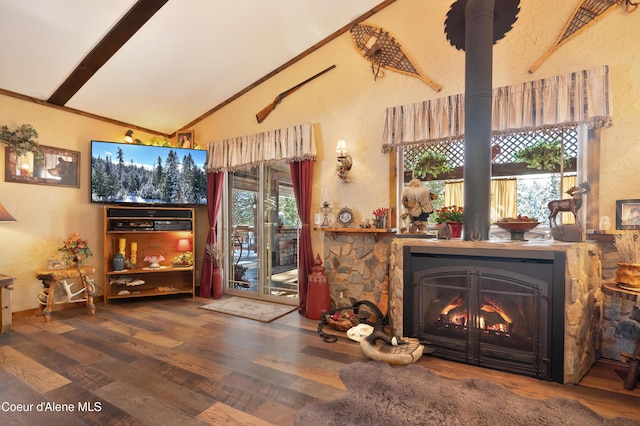 living room with ornamental molding, lofted ceiling, and hardwood / wood-style floors