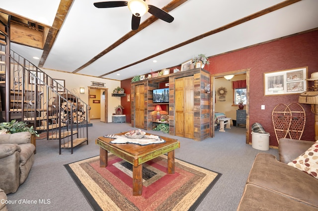 carpeted living room with beam ceiling and ceiling fan