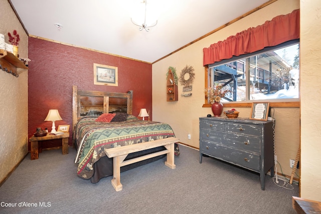 bedroom with crown molding and carpet