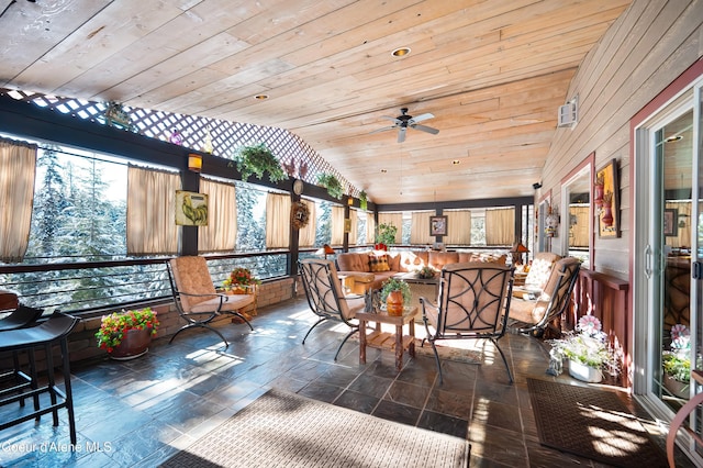 sunroom / solarium with vaulted ceiling, wooden ceiling, and ceiling fan