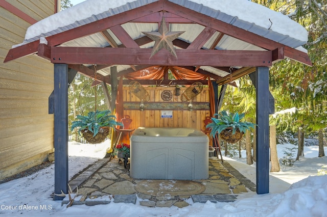 snow covered patio featuring a gazebo