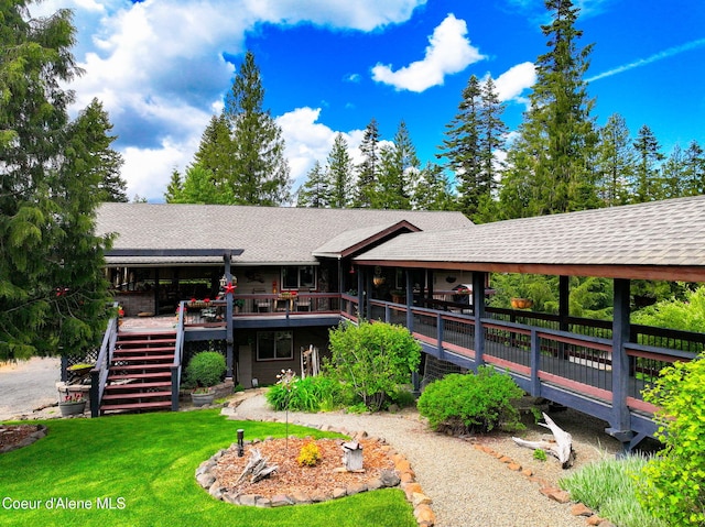 110 Shamrock Ln, Saint Maries, ID 83861 - back of property with stairs, a deck, a yard, and a shingled roof