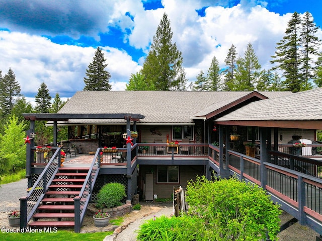 110 Shamrock Ln, Saint Maries, ID 83861 - back of house featuring stairway, a shingled roof, and a wooden deck