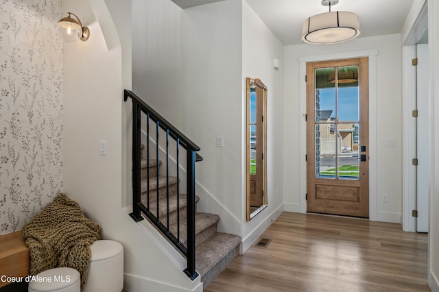 entryway with plenty of natural light and light hardwood / wood-style floors