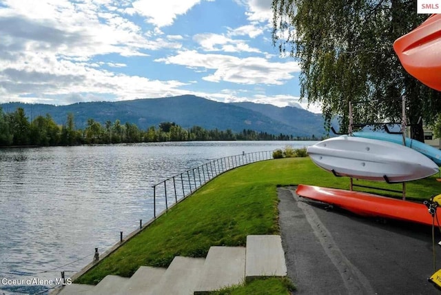 exterior space featuring a water and mountain view