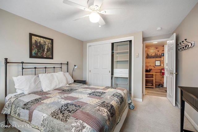 bedroom with light carpet, a closet, a ceiling fan, and baseboards