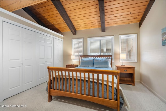 bedroom with wood ceiling, multiple windows, vaulted ceiling with beams, and light carpet