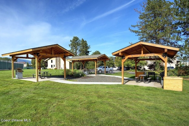 view of community with a lawn and a gazebo