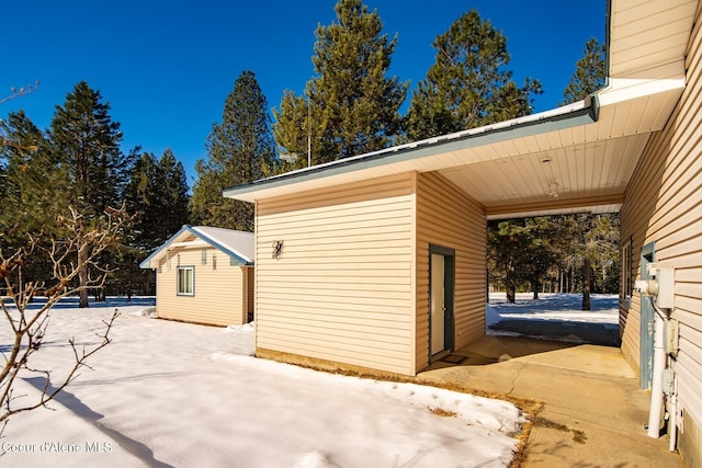 exterior space featuring an outdoor structure and a carport