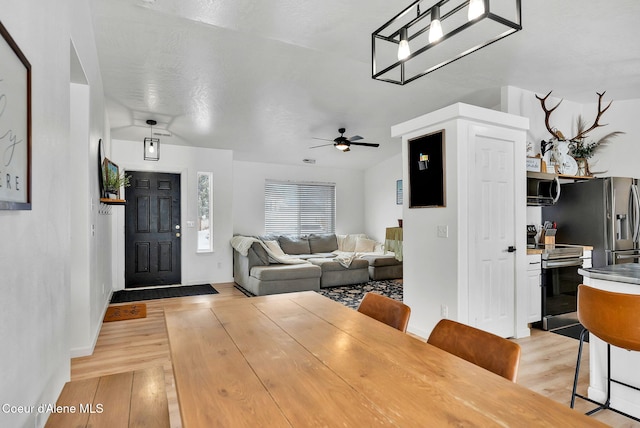 entrance foyer with light wood-type flooring and ceiling fan