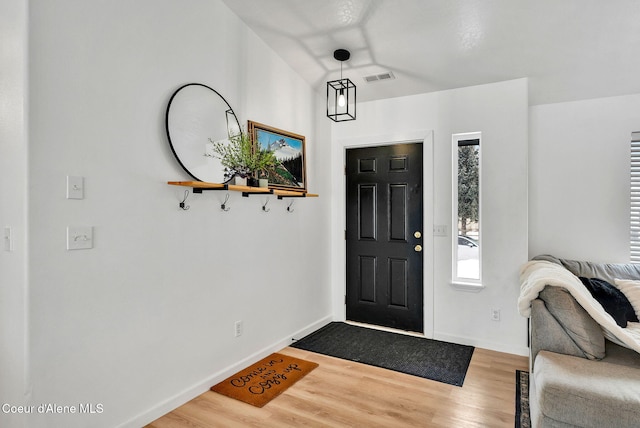 entrance foyer with hardwood / wood-style floors