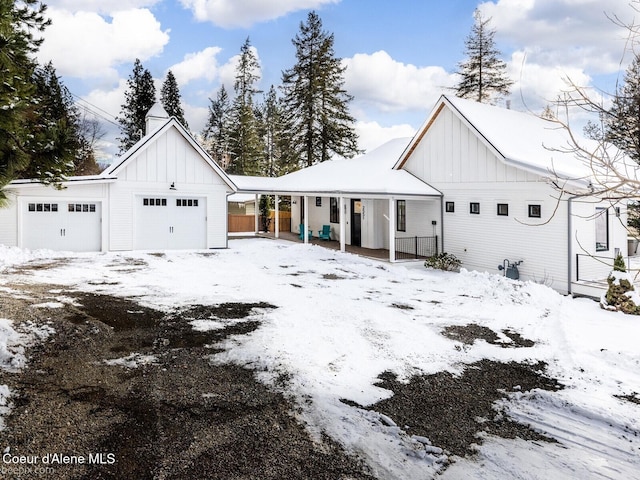 modern inspired farmhouse with a garage