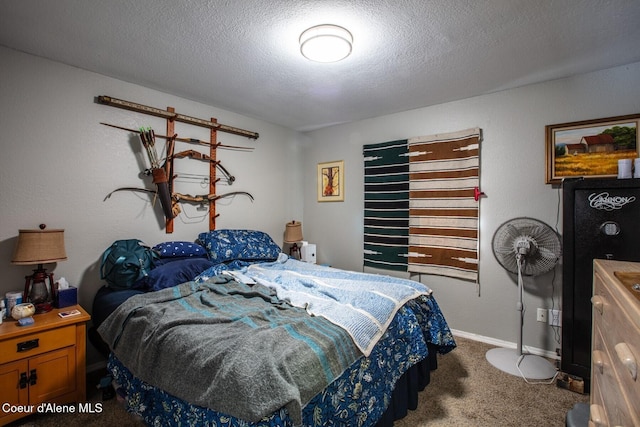 bedroom featuring carpet and a textured ceiling