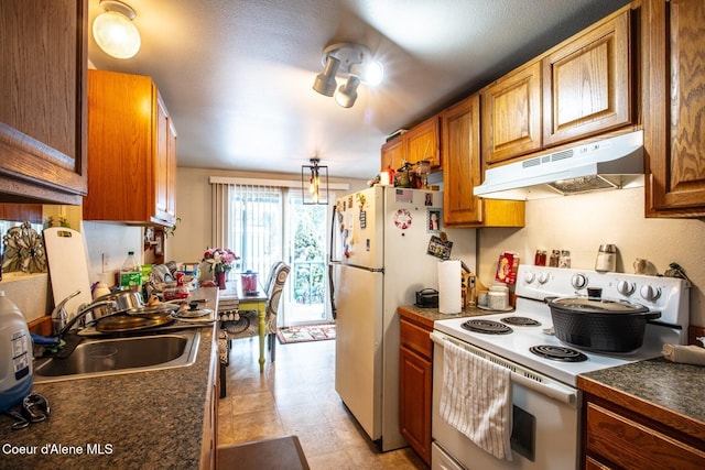 kitchen with white appliances and sink