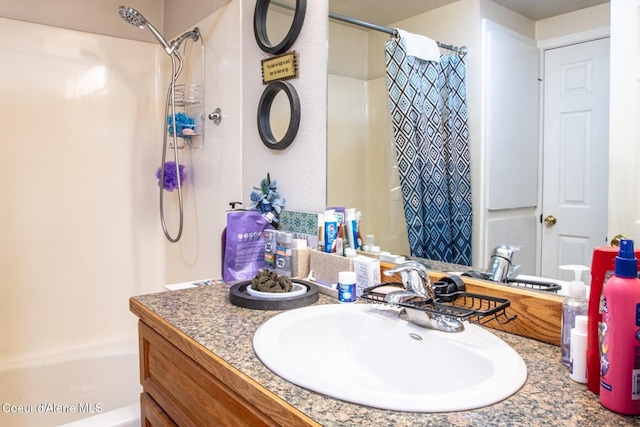 bathroom with vanity and shower / bath combo