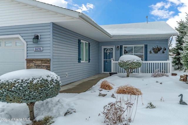 view of snow covered property entrance