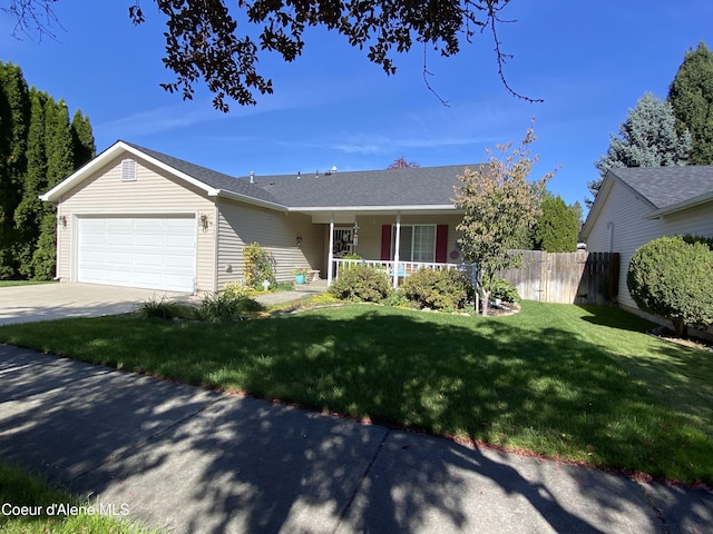 ranch-style home with an attached garage, covered porch, fence, driveway, and a front yard