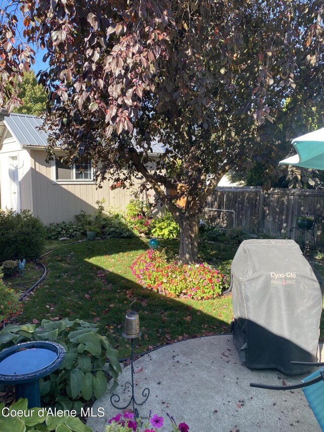 view of yard featuring a patio area and fence