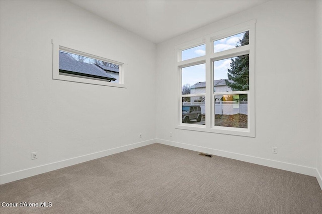 empty room featuring carpet flooring