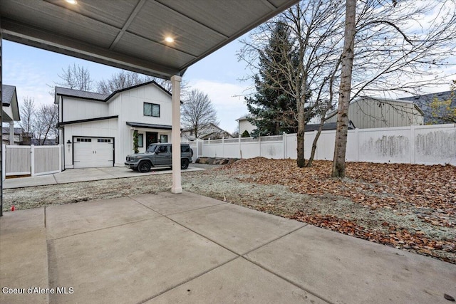 view of patio featuring a garage