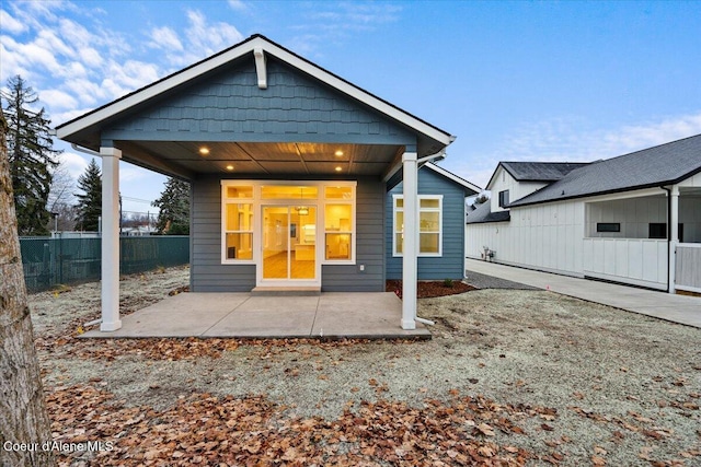 back of property with a patio area