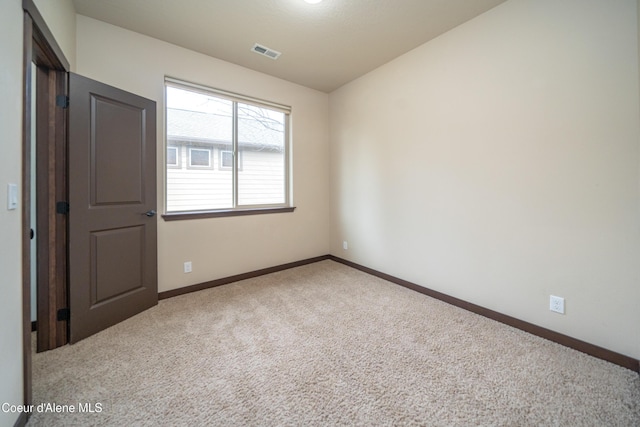 unfurnished bedroom featuring visible vents, baseboards, and carpet