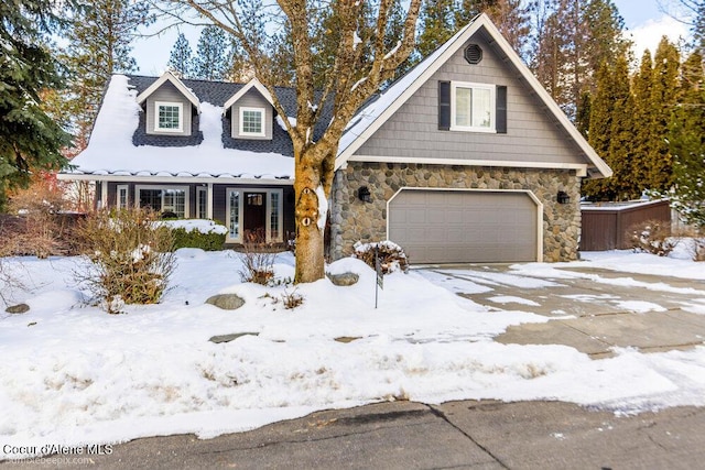 view of front of house featuring stone siding and an attached garage