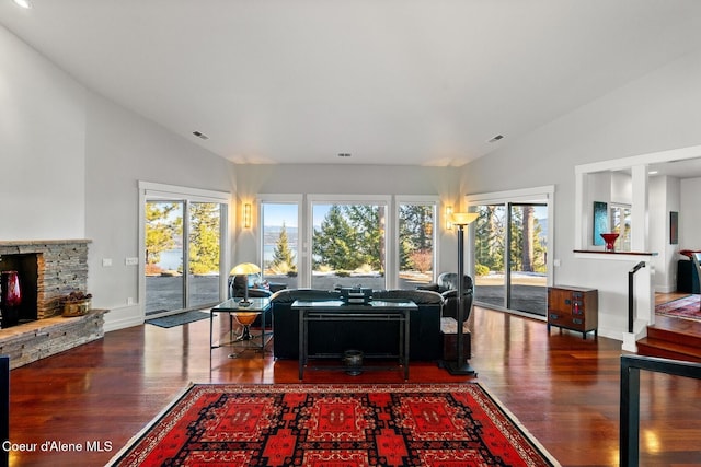 5006 S Brentwood Ln, Coeur Dalene, ID 83814 - living room with a healthy amount of sunlight, a fireplace, baseboards, and wood finished floors