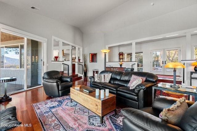 5006 S Brentwood Ln, Coeur Dalene, ID 83814 - living area featuring french doors, visible vents, vaulted ceiling, and wood finished floors